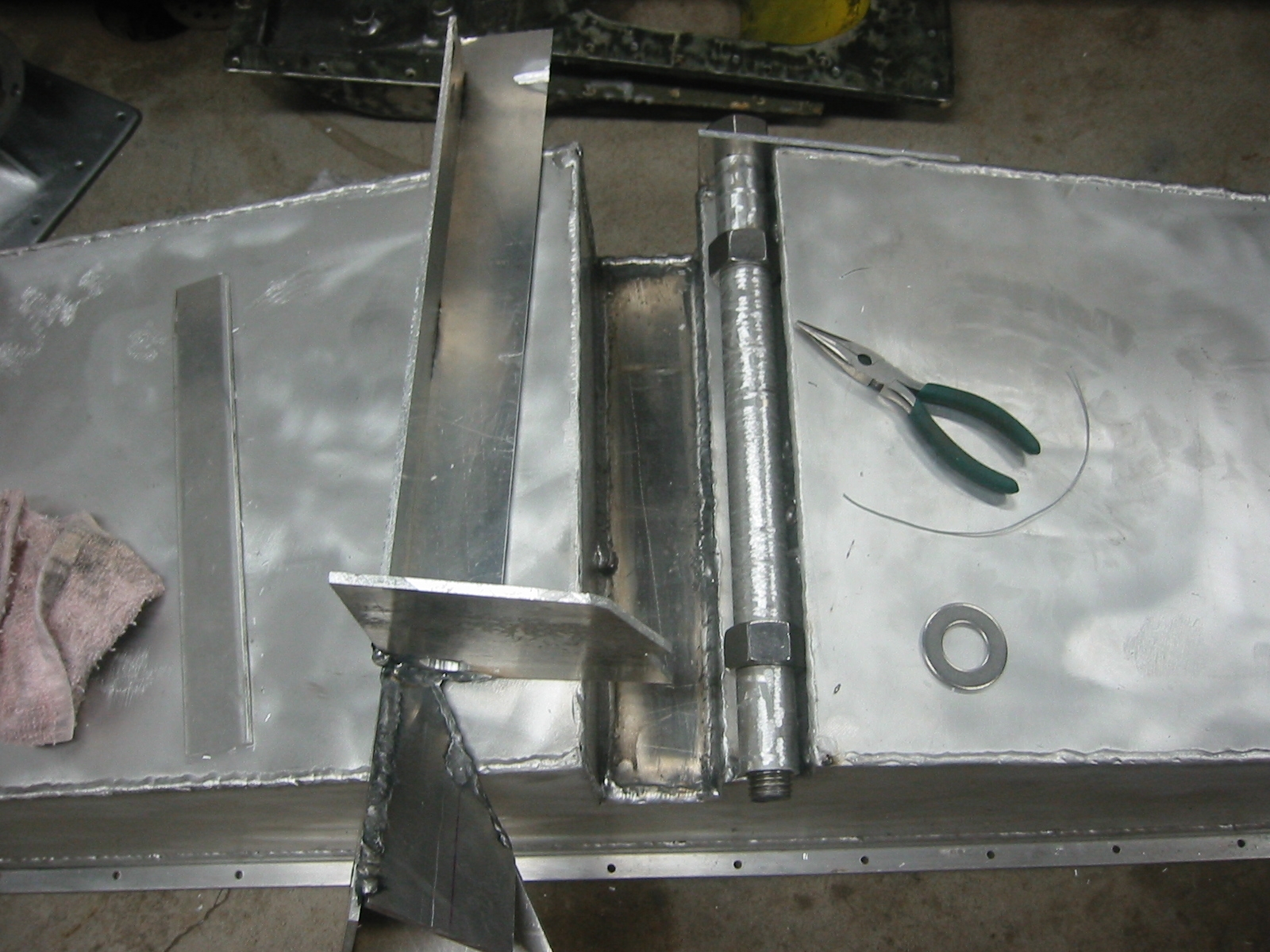 Aluminum mold to cast lead screw nuts. Sections of pipe protect the screw. A sprue was built to direct the flow of molten aluminum.