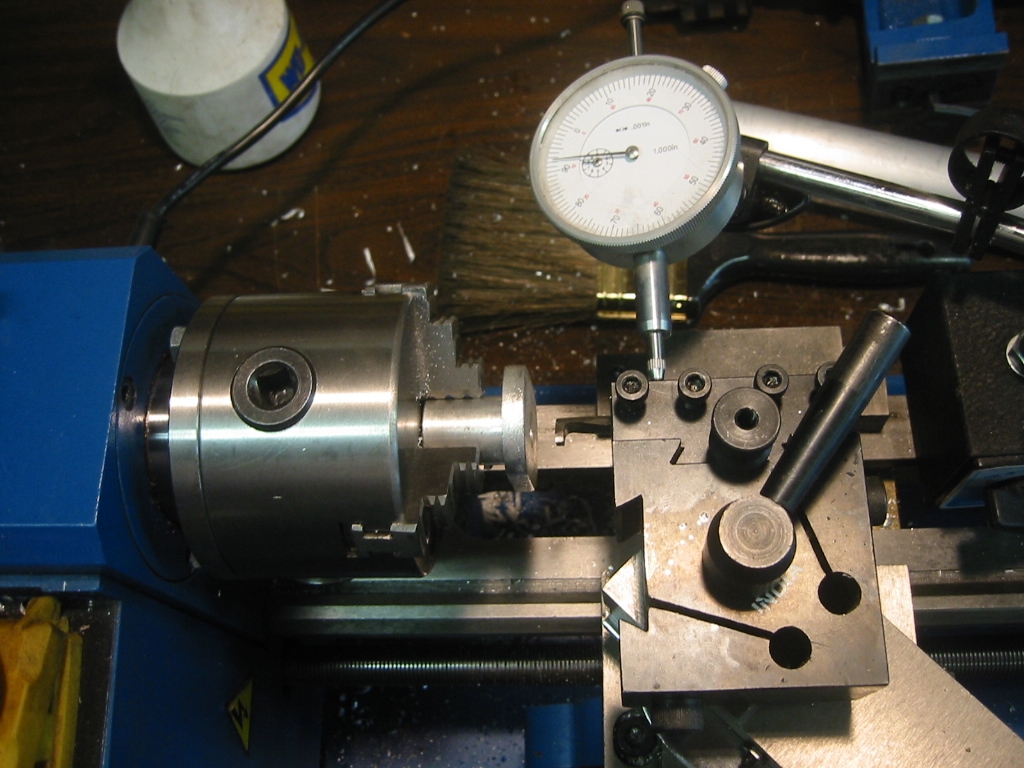Dial caliper setup to measure the depth of the groove.