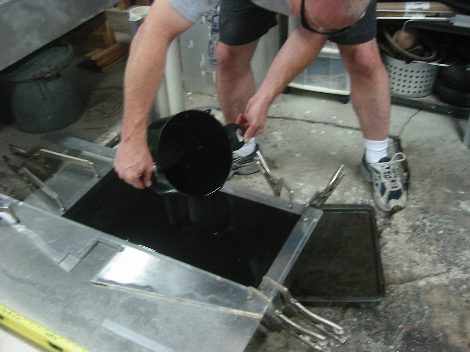 Machineable wax being poured into the mold.