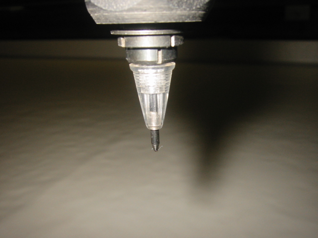 Modified ballpoint pen fit into the CNC's router.