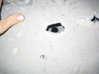 Holes through the Hummers armored door.